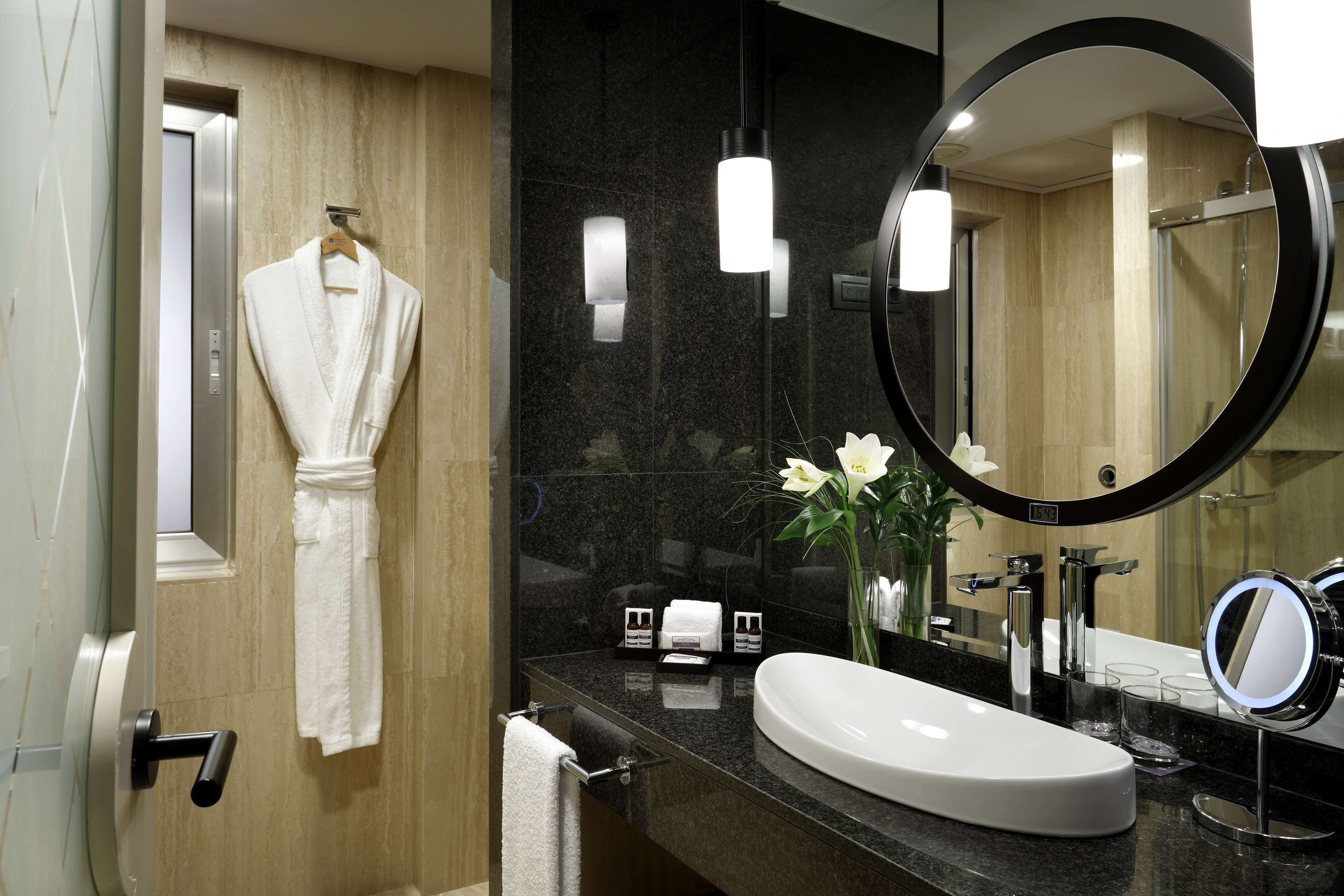 designer toiletries, hair dryer, bathrobes, slippers