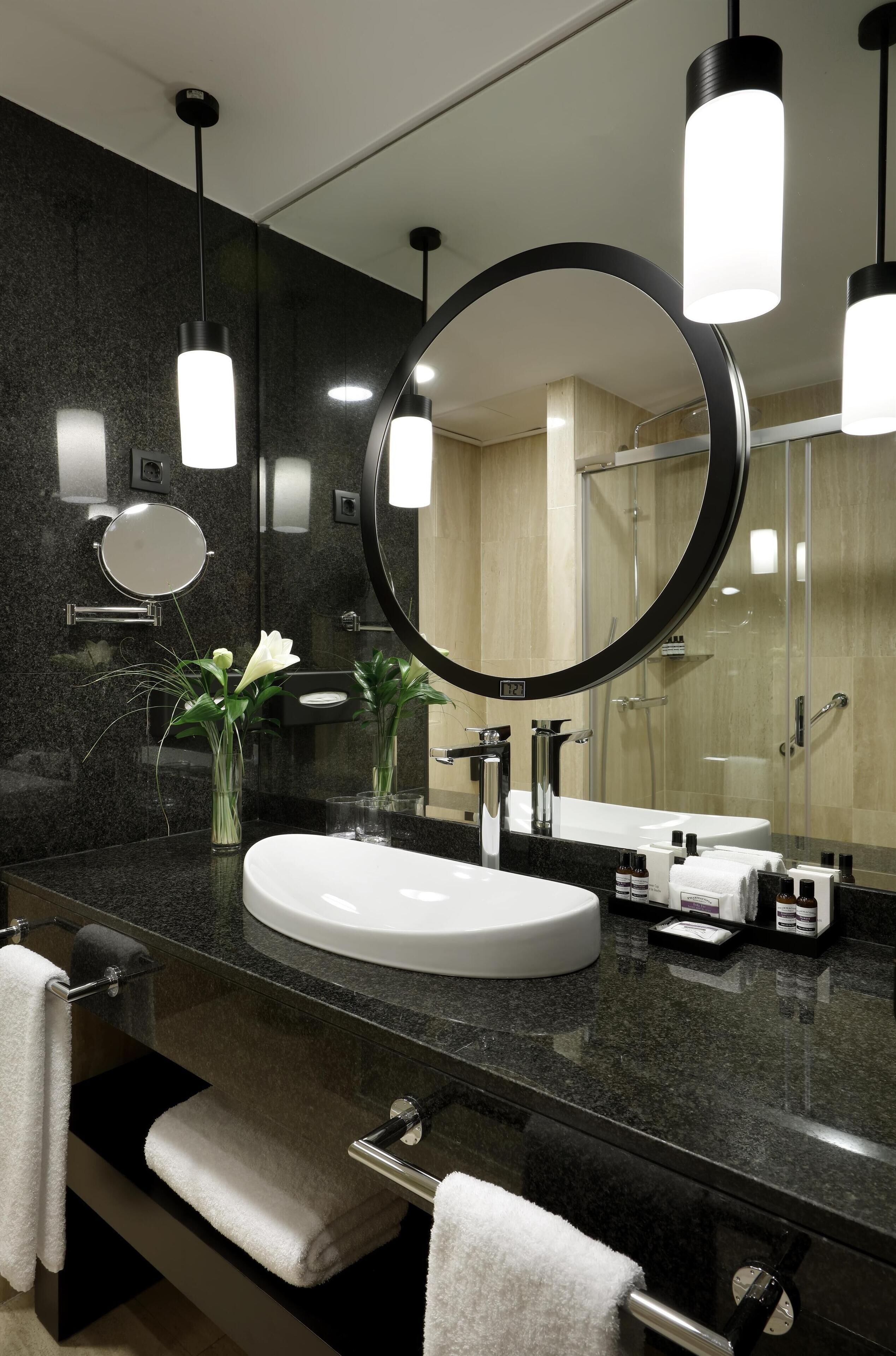 Designer toiletries, hair dryer, bathrobes, slippers