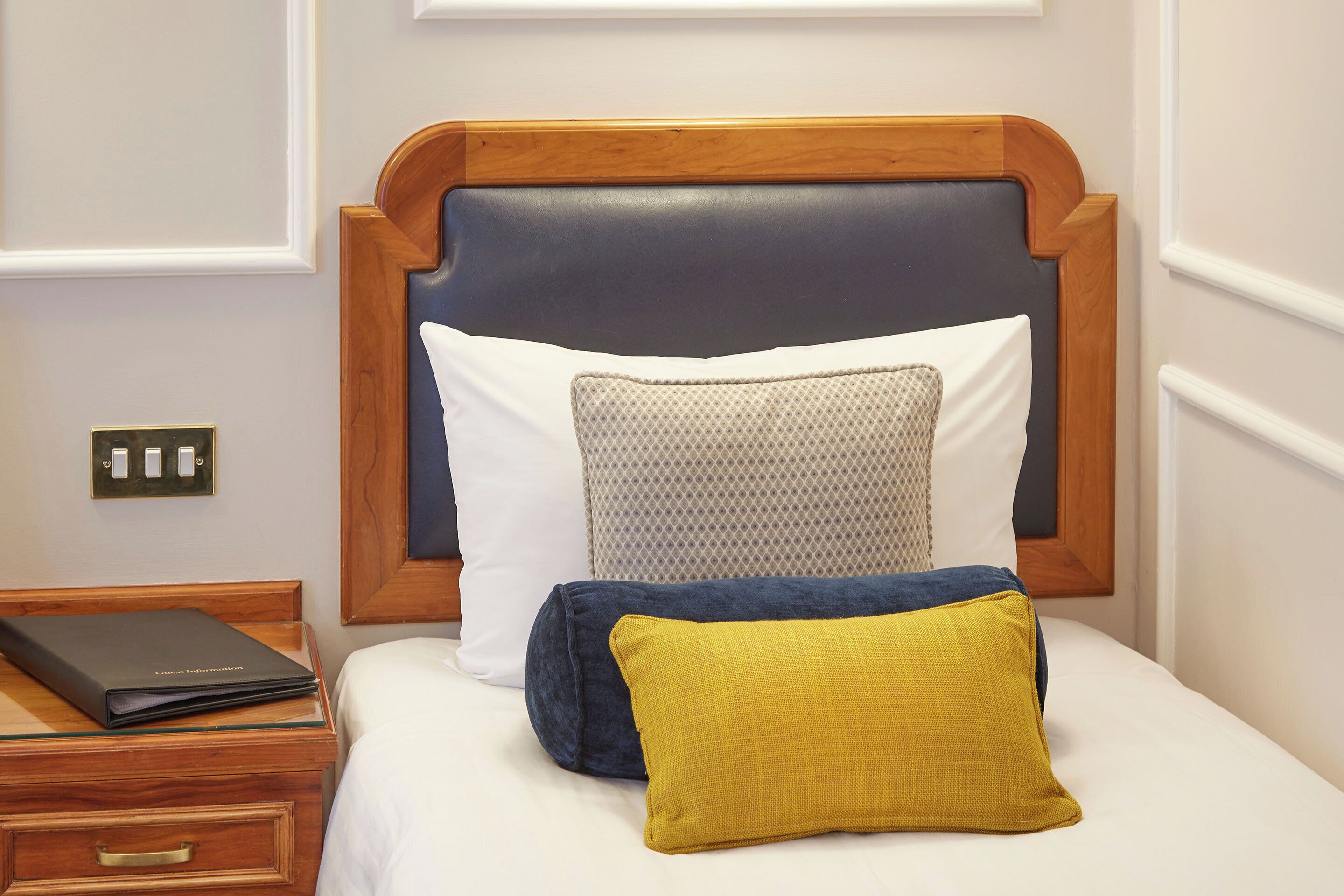 comfort room, 1 single bed | in-room safe, desk, laptop workspace, iron/ironing board