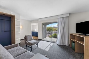 Suite, 1 King Bed, Patio, Pool View | Living area | LCD TV