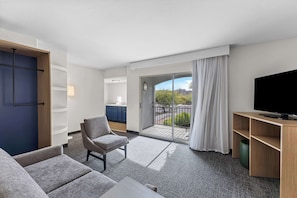 Suite, 1 King Bed, Patio, Pool View | Living area