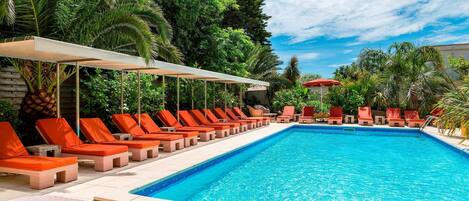 Seasonal outdoor pool, open 8:00 AM to 7:00 PM, pool umbrellas