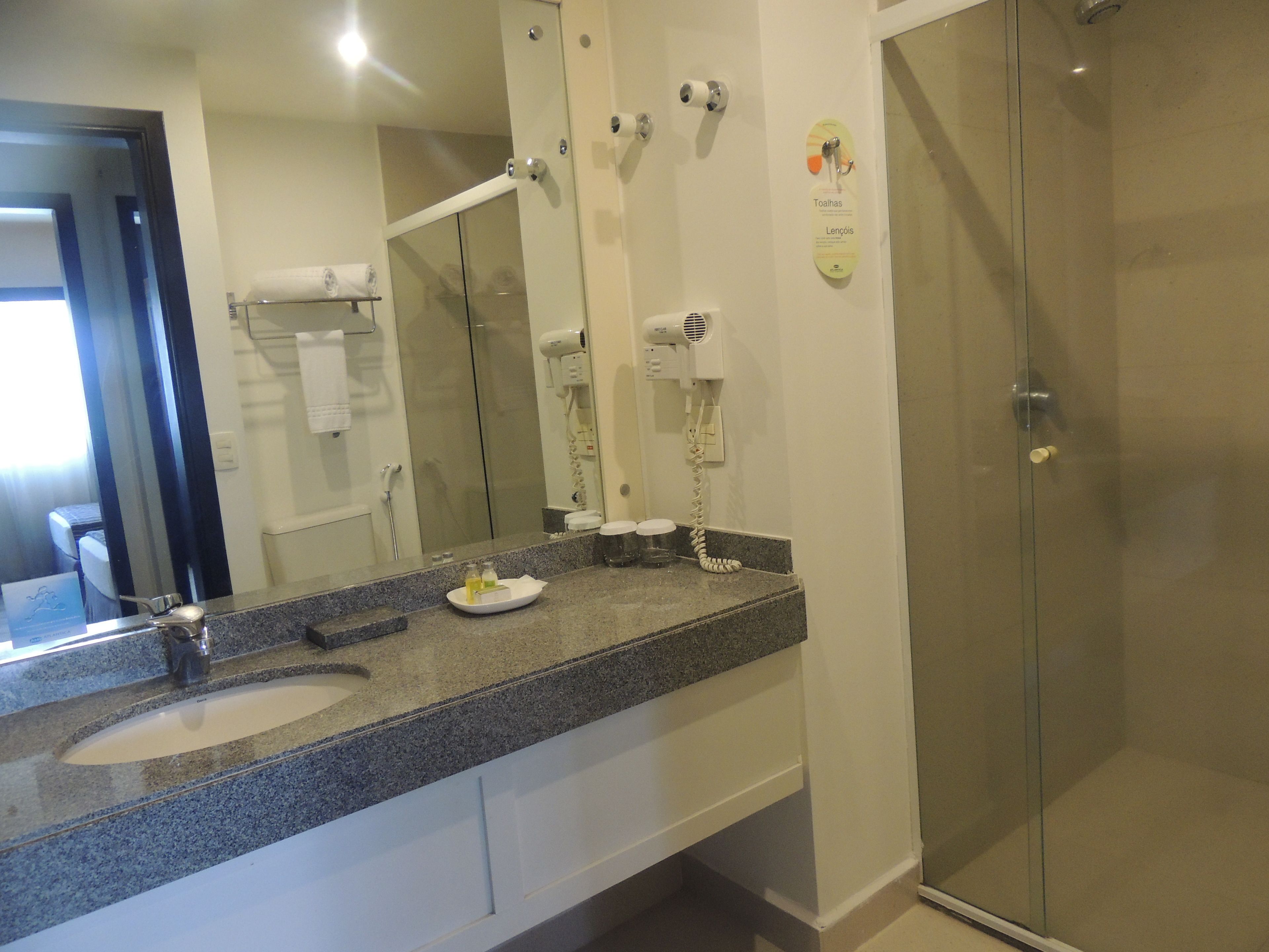 executive suite, 1 king bed, non smoking | bathroom | shower, rainfall showerhead, free toiletries, towels