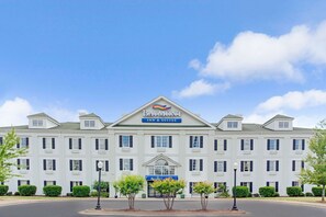 Baymont Inn & Suites features a symmetrical facade with a central entrance and gabled roof.