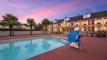 Seasonal outdoor pool, open 9:00 AM to 9:00 PM, pool loungers