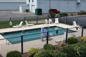 Seasonal outdoor pool, pool loungers