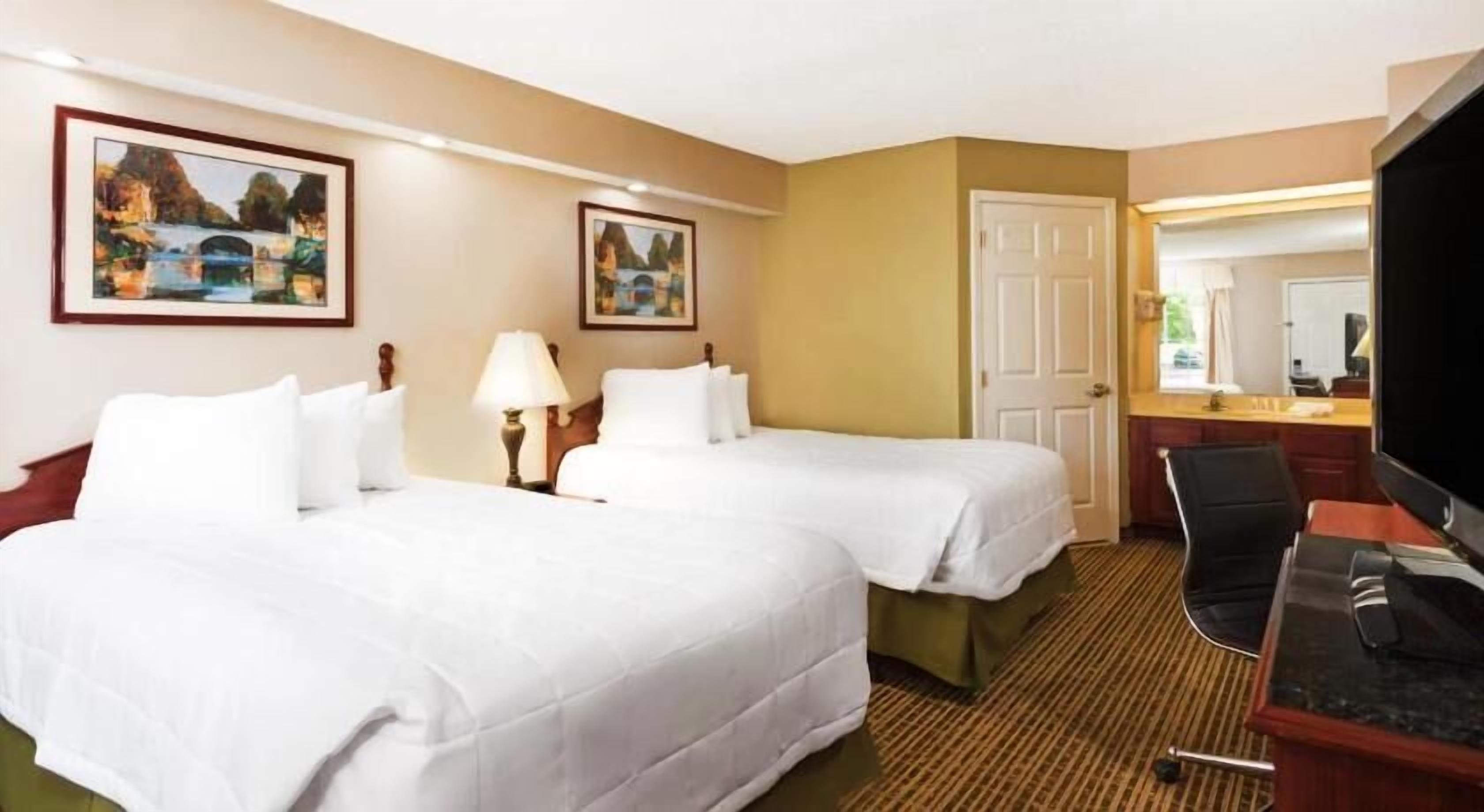 Pillow-top beds, desk, laptop workspace, blackout curtains