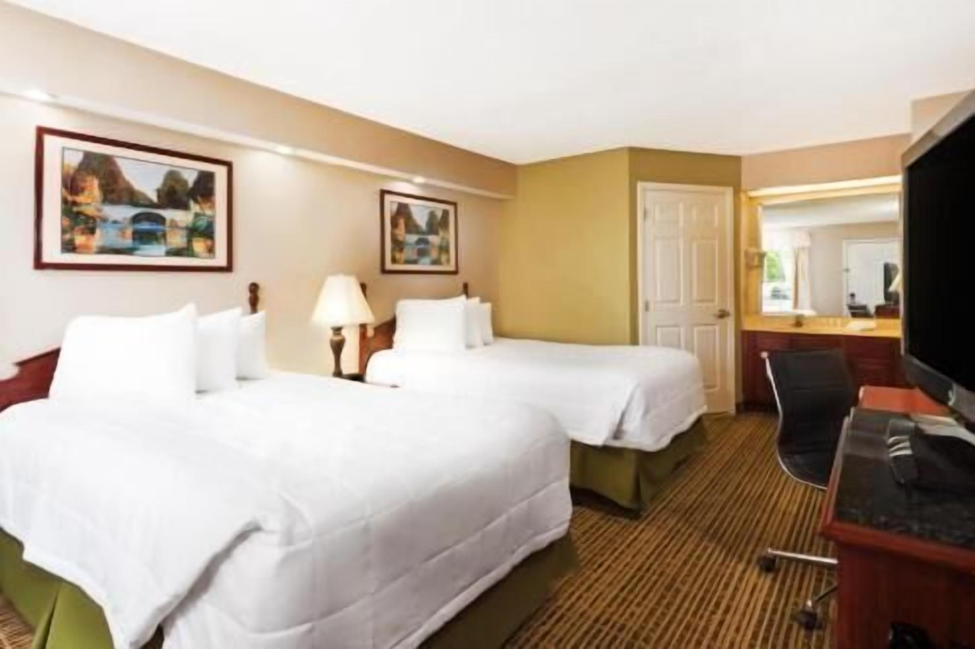Pillow-top beds, desk, laptop workspace, blackout curtains