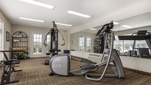 A gym with treadmills, elliptical machines, and weight equipment. - Quality Inn Lancaster (Lancaster)