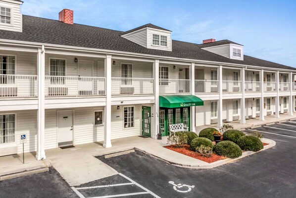 Classic motel with balconies on each floor, offering a traditional stay.