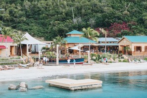 On the beach, white sand, free beach cabanas, sun loungers