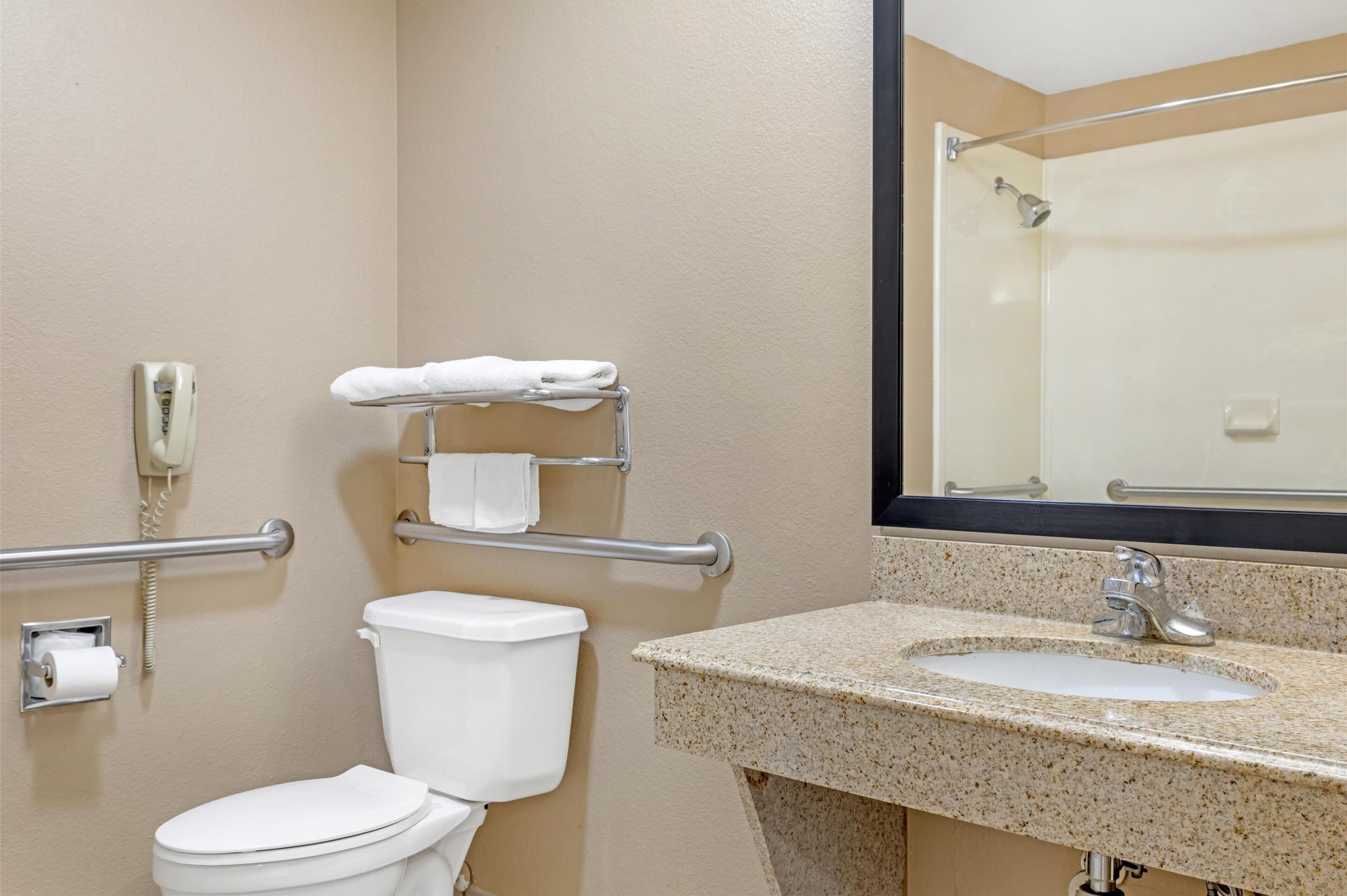 standard room, 1 king bed, accessible, jetted tub | bathroom | combined shower/bathtub, free toiletries, hair dryer, towels
