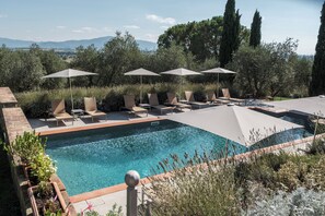 Seasonal outdoor pool, open 8:00 AM to 8:00 PM, pool umbrellas