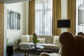 Junior Suite, 1 Bedroom | Living room | 84-inch flat-screen TV with cable channels, TV - Hotel Marignan Champs - Elysées (Paris)