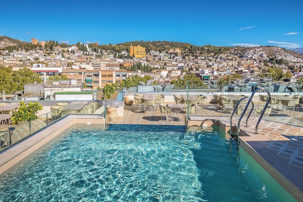 Seasonal outdoor pool, pool loungers