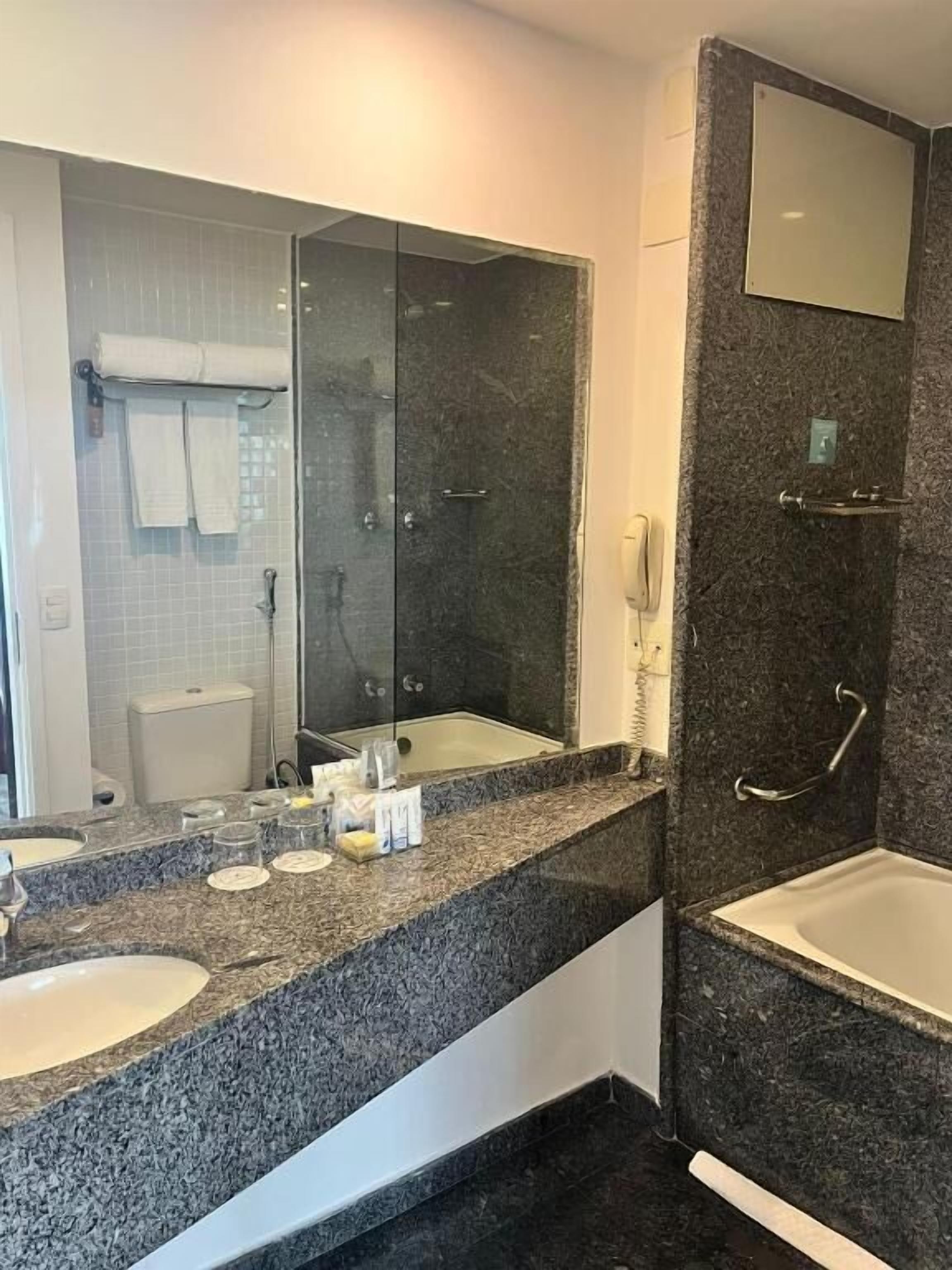 premium double room | bathroom | shower, rainfall showerhead, free toiletries, hair dryer