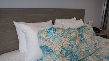 Premium bedding, down duvets, pillow-top beds, blackout curtains