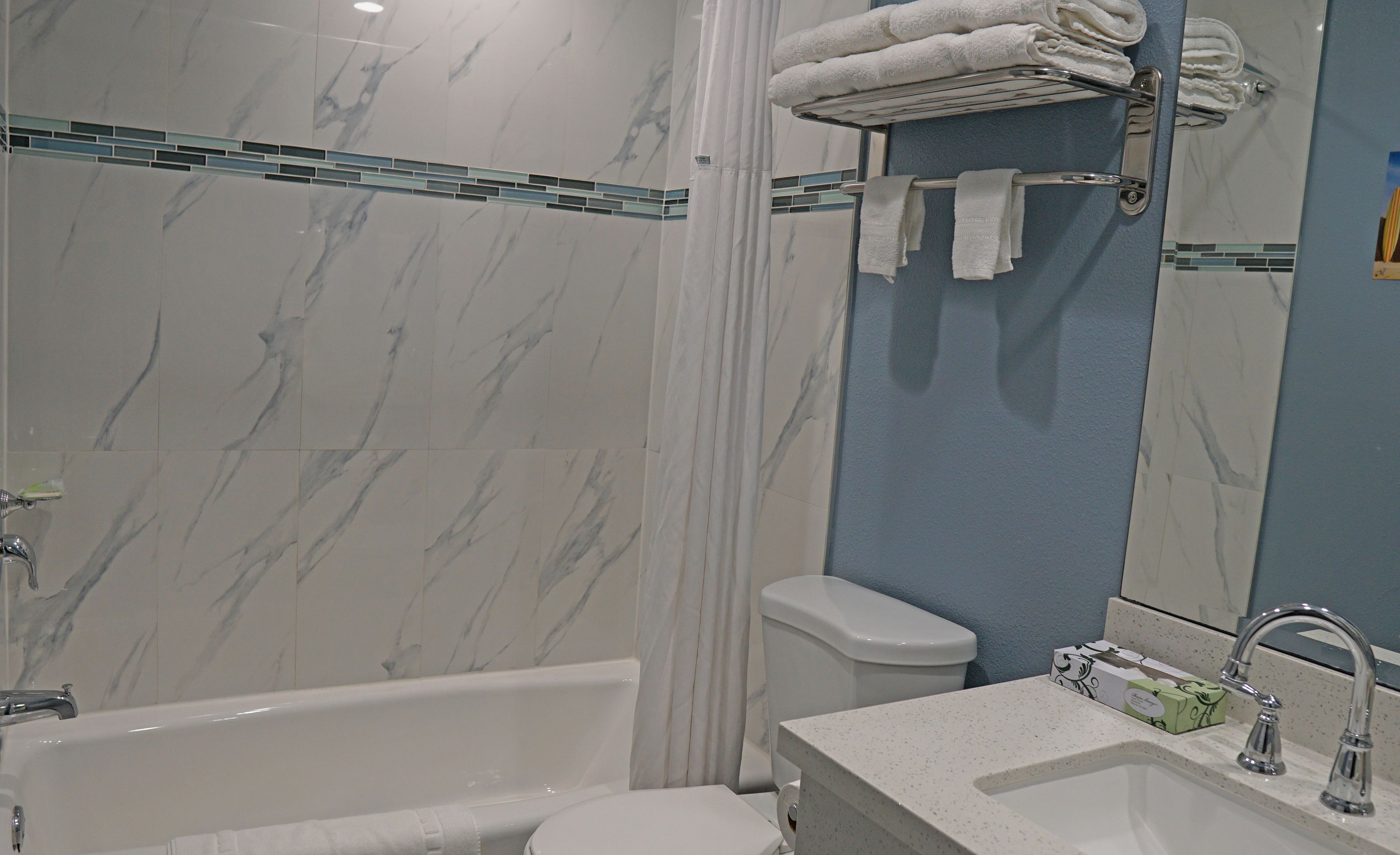 combined shower/bathtub, free toiletries, hair dryer, towels