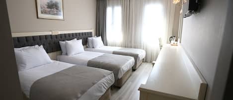 Triple Room, 3 Single Beds | Premium bedding, minibar, in-room safe, individually decorated