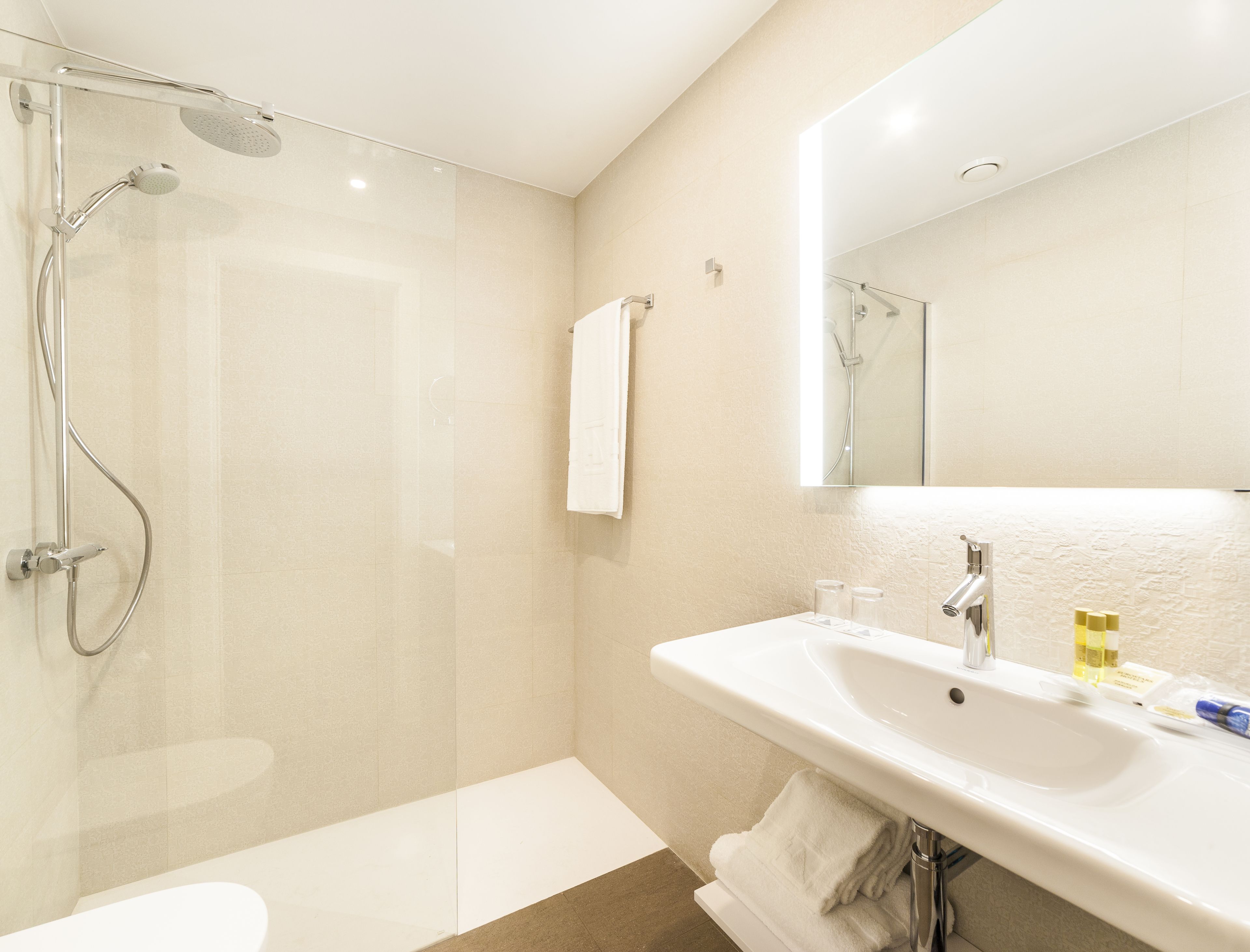 shower, eco-friendly toiletries, hair dryer, towels