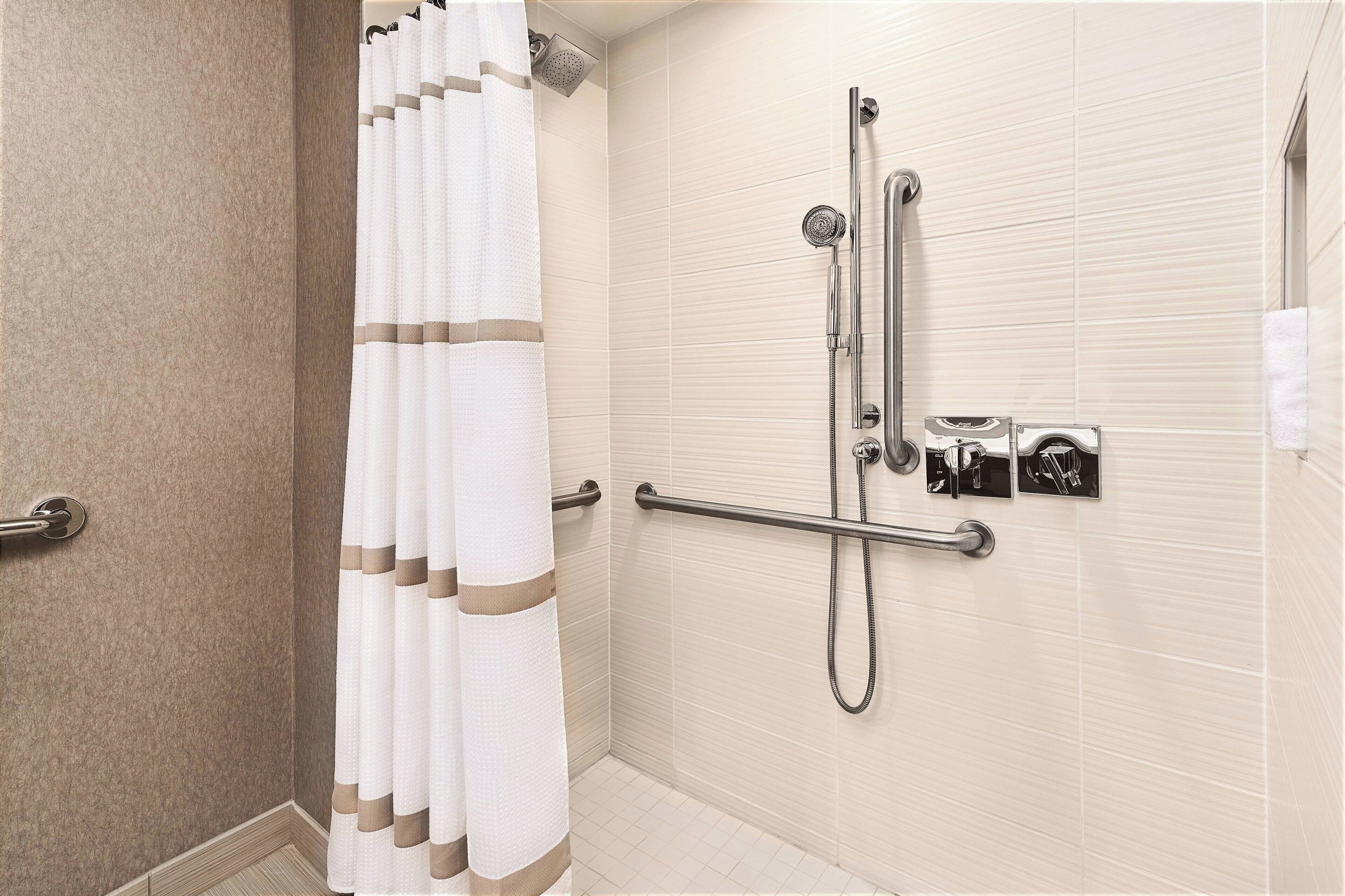 designer toiletries, hair dryer, towels