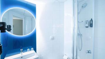 Shower, eco-friendly toiletries, hair dryer, towels
