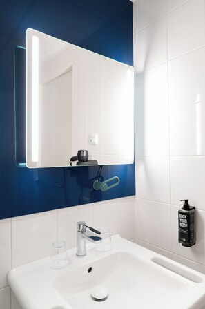 Shower, eco-friendly toiletries, hair dryer, towels