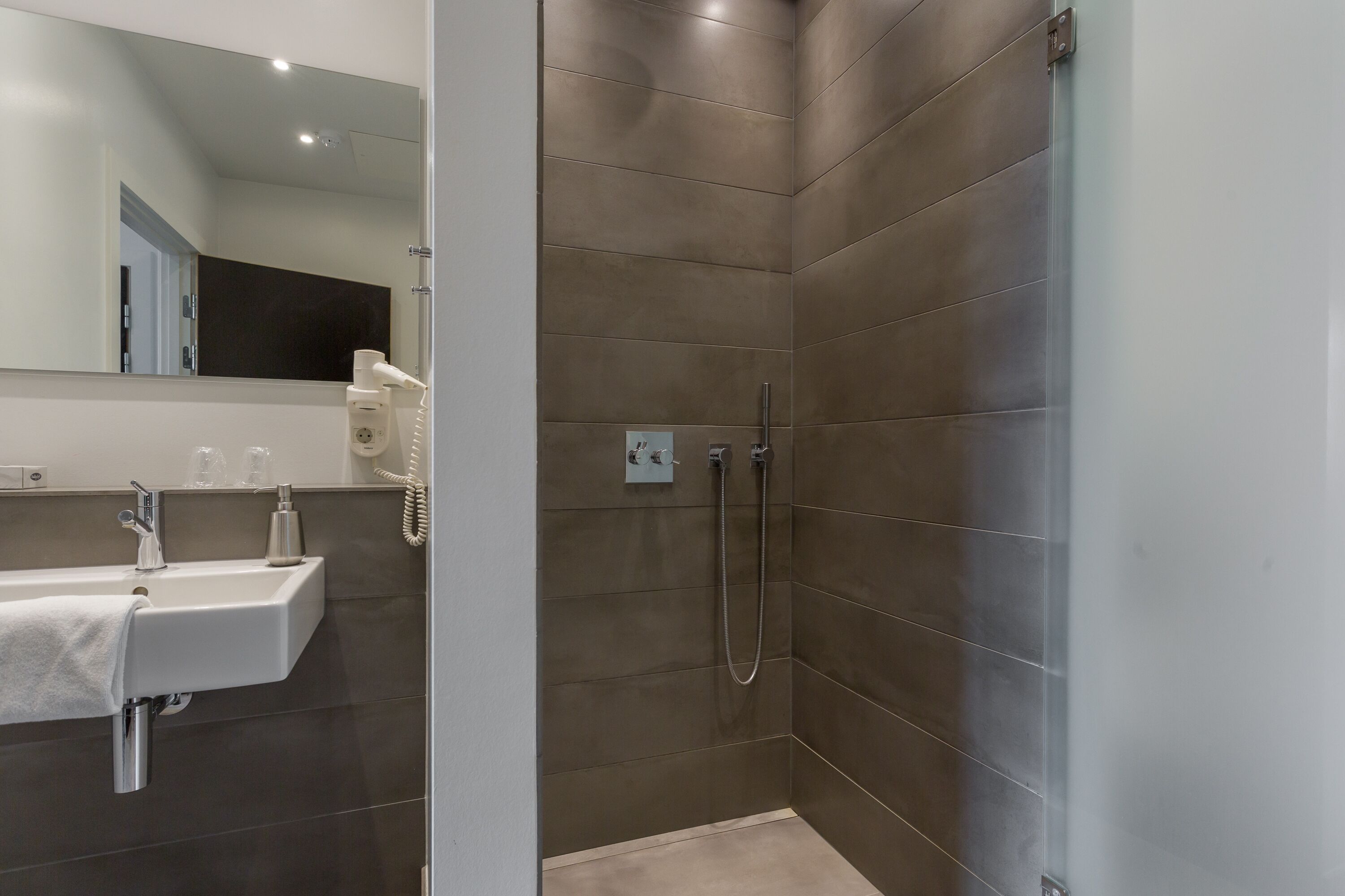 Eco-friendly toiletries, hair dryer, towels, soap