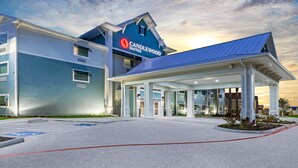 A hotel with a modern design, featuring a prominent "Candlewood Suites" sign. - Candlewood Suites Aransas Pass by IHG (Aransas Pass)