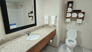 Suite, 1 King Bed, Non Smoking | Bathroom | Free toiletries, hair dryer, towels