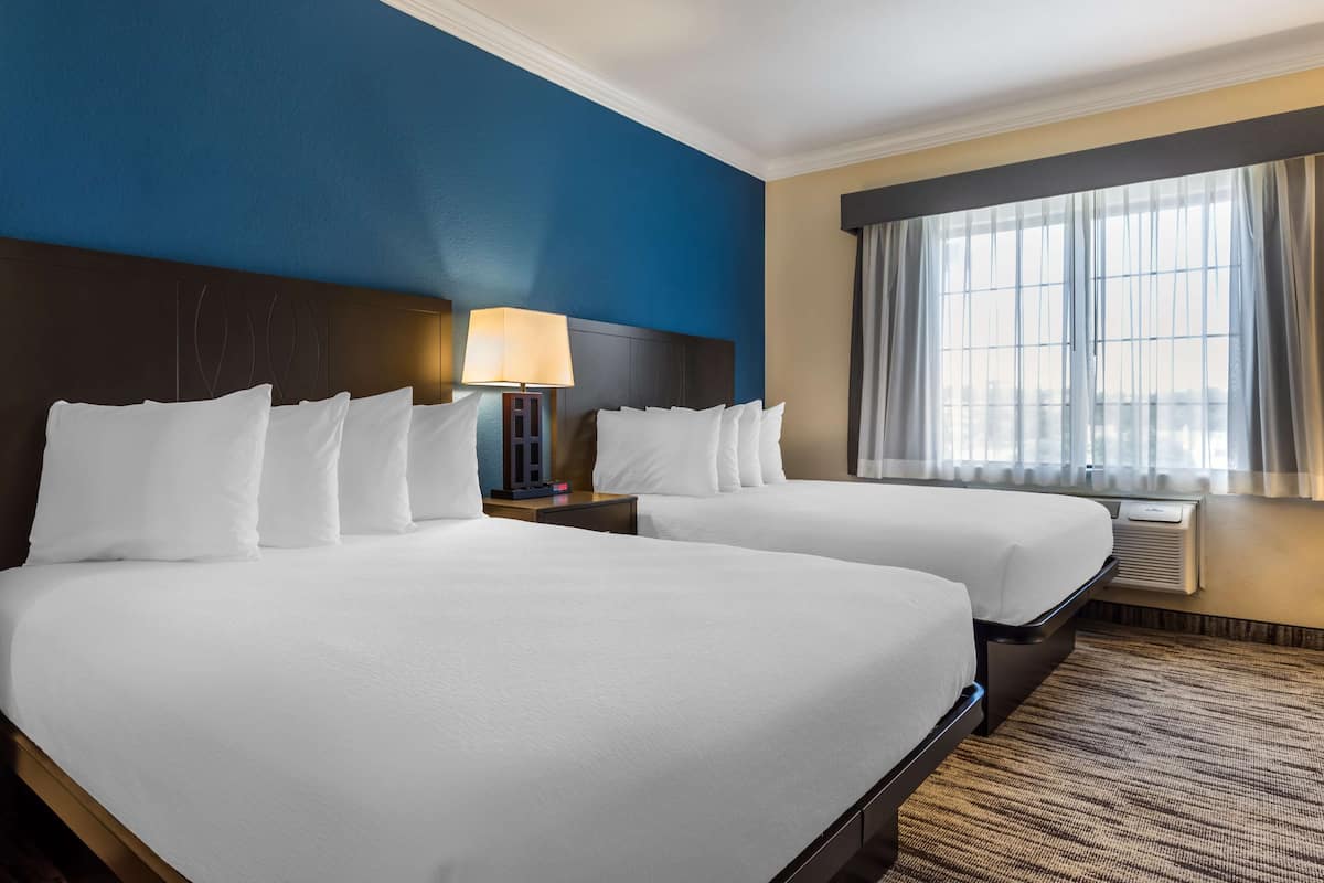 suite, 2 queen beds, non smoking, microwave (with sofabed) | 1 bedroom, desk, laptop workspace, blackout curtains