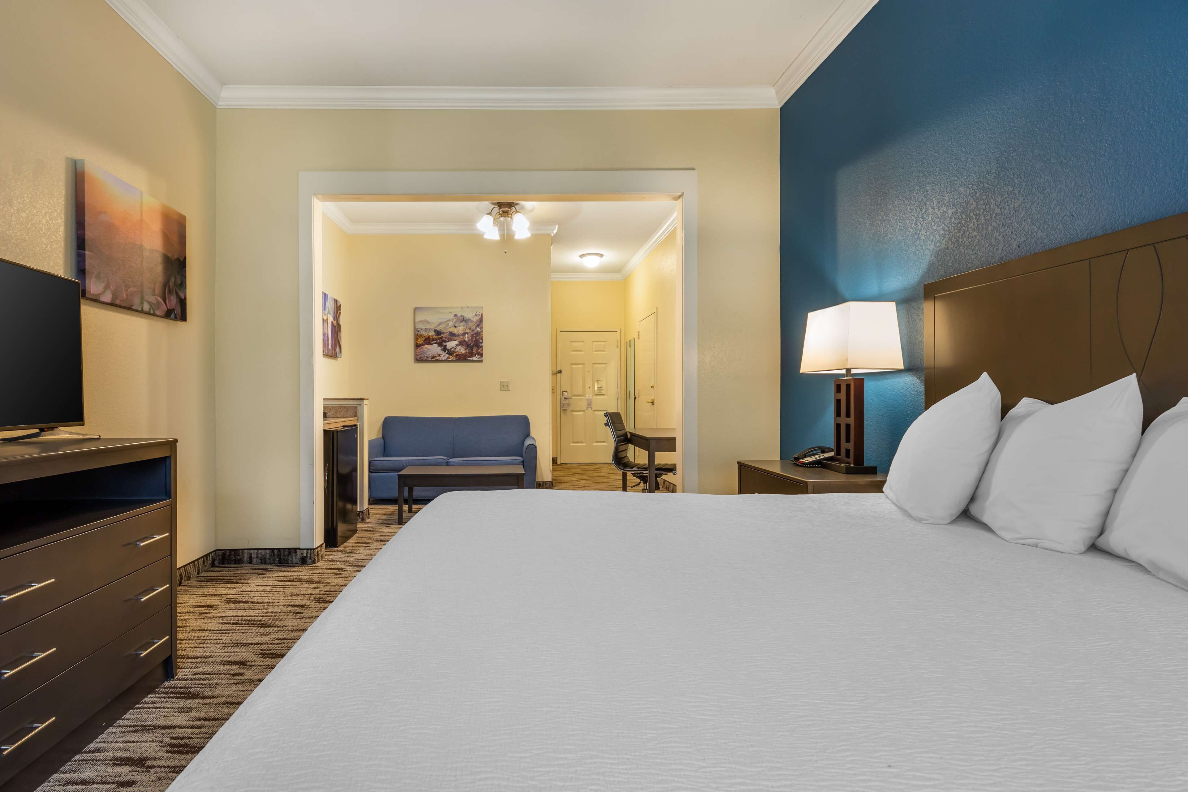 Desk, laptop workspace, blackout drapes, iron/ironing board