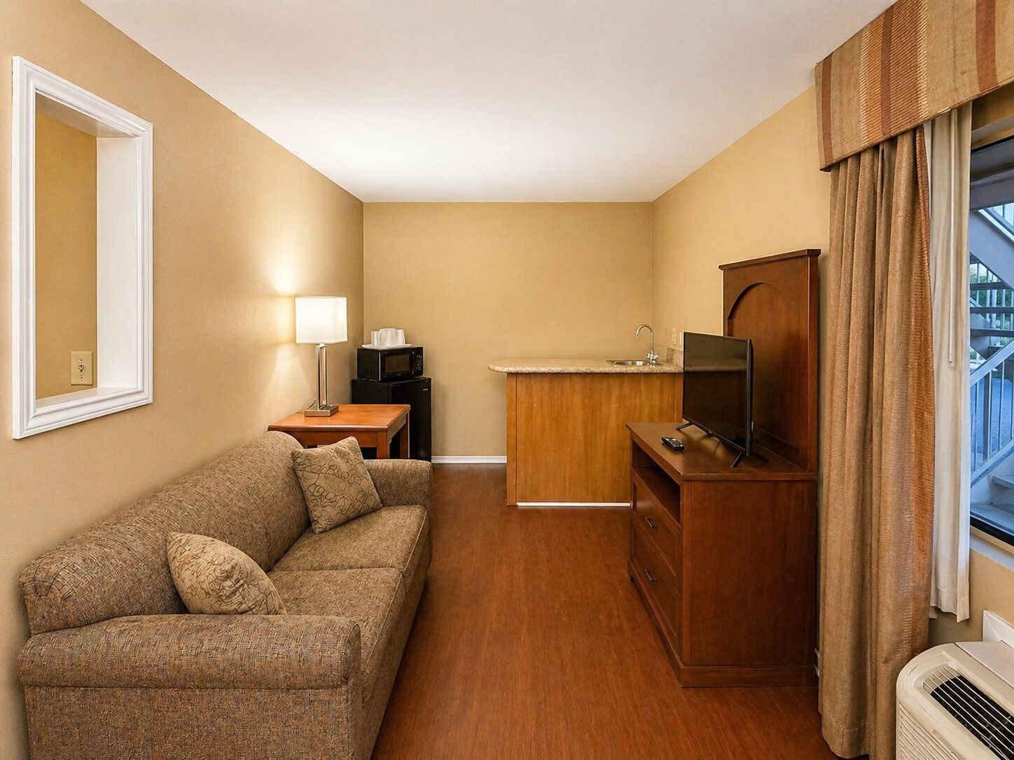 Suite, 1 King Bed, Non Smoking | Individually furnished, desk, laptop workspace, blackout curtains