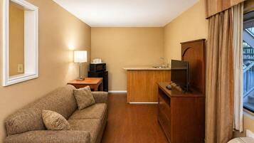 Suite, 1 King Bed, Non Smoking | Individually furnished, desk, laptop workspace, blackout curtains