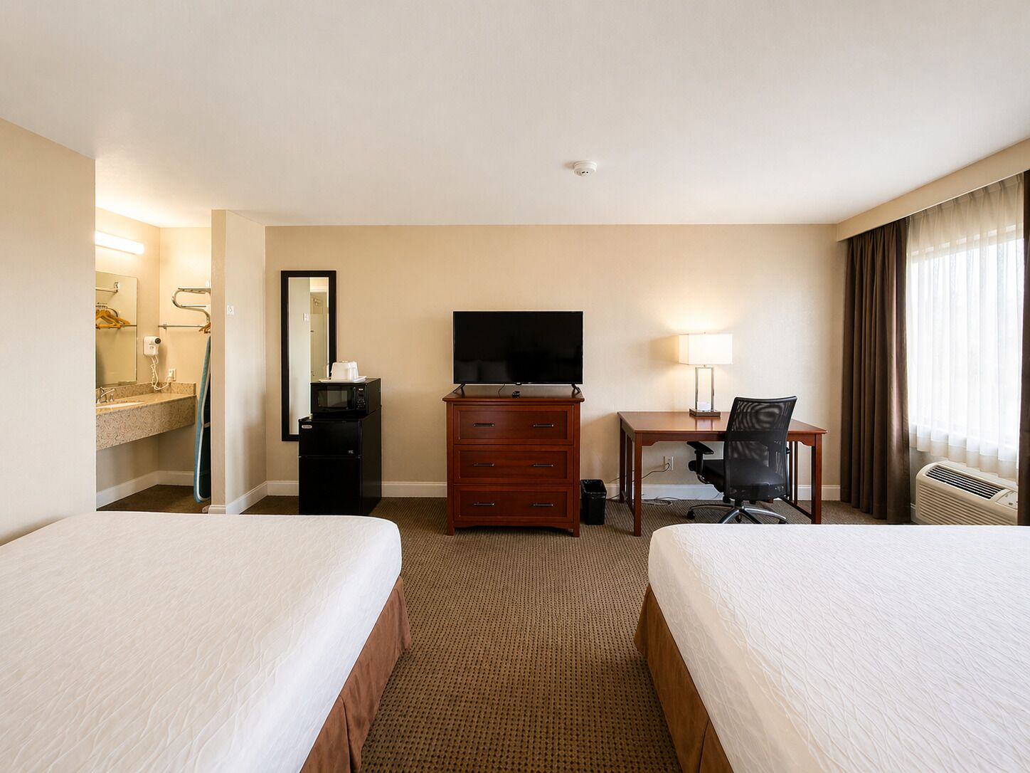 Individually furnished, desk, laptop workspace, blackout drapes