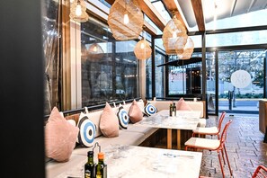 Breakfast, lunch, dinner served; international cuisine, pool views 