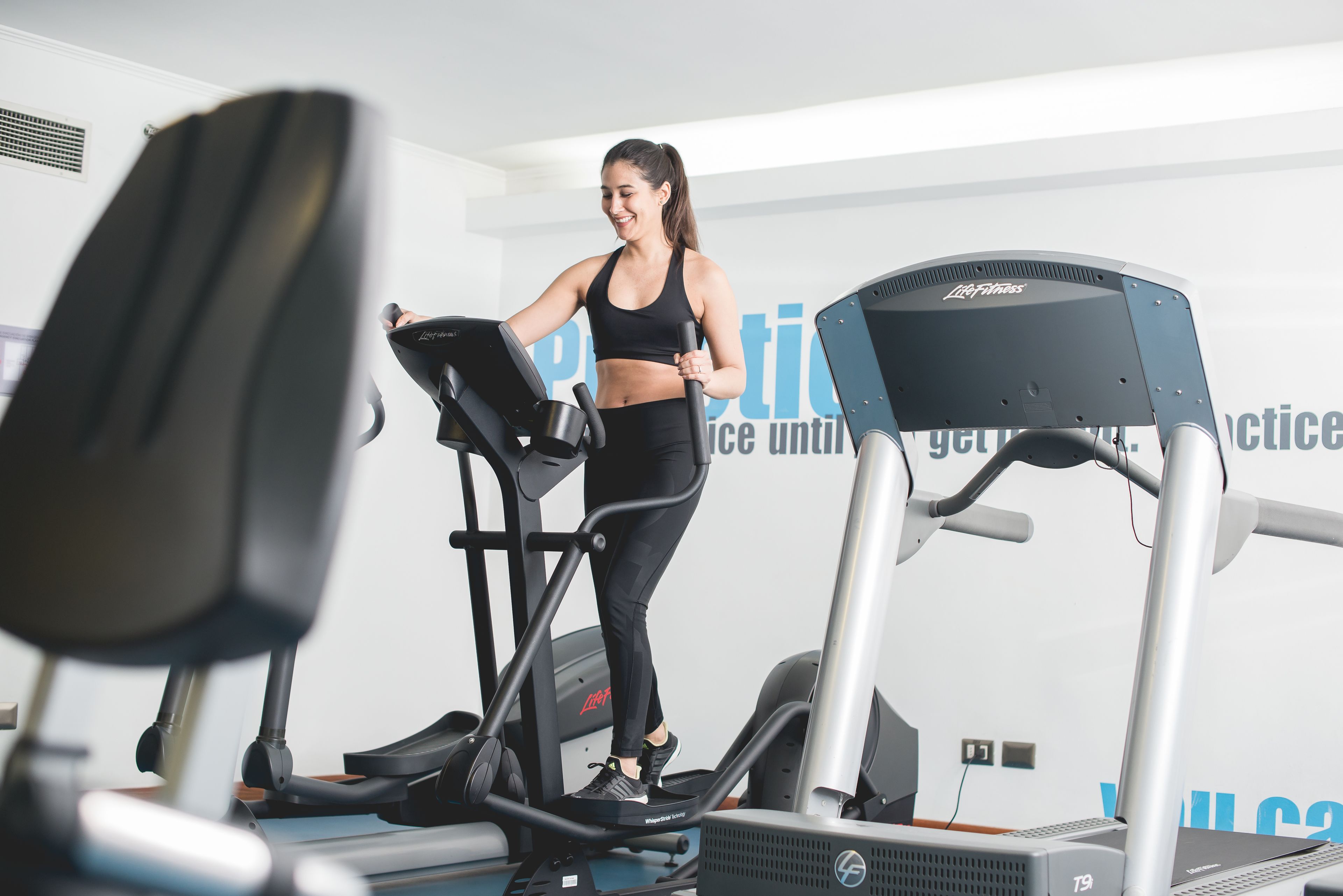 A gym with treadmills and exercise equipment.
