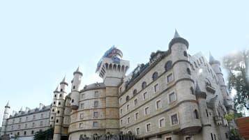 A castle-like building with multiple towers and a sign reading "Best Western."