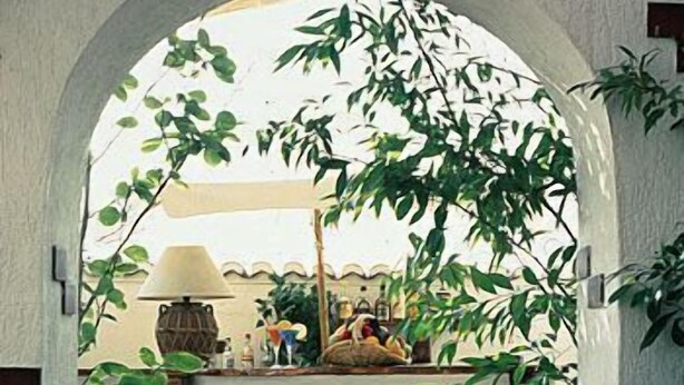 An arched doorway leading to a patio area with two wooden chairs and a table, surrounded by potted plants. - The Park Hotel Piraeus (Piraeus)