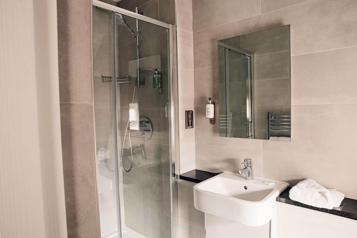 combined shower/bathtub, hair dryer, towels, soap