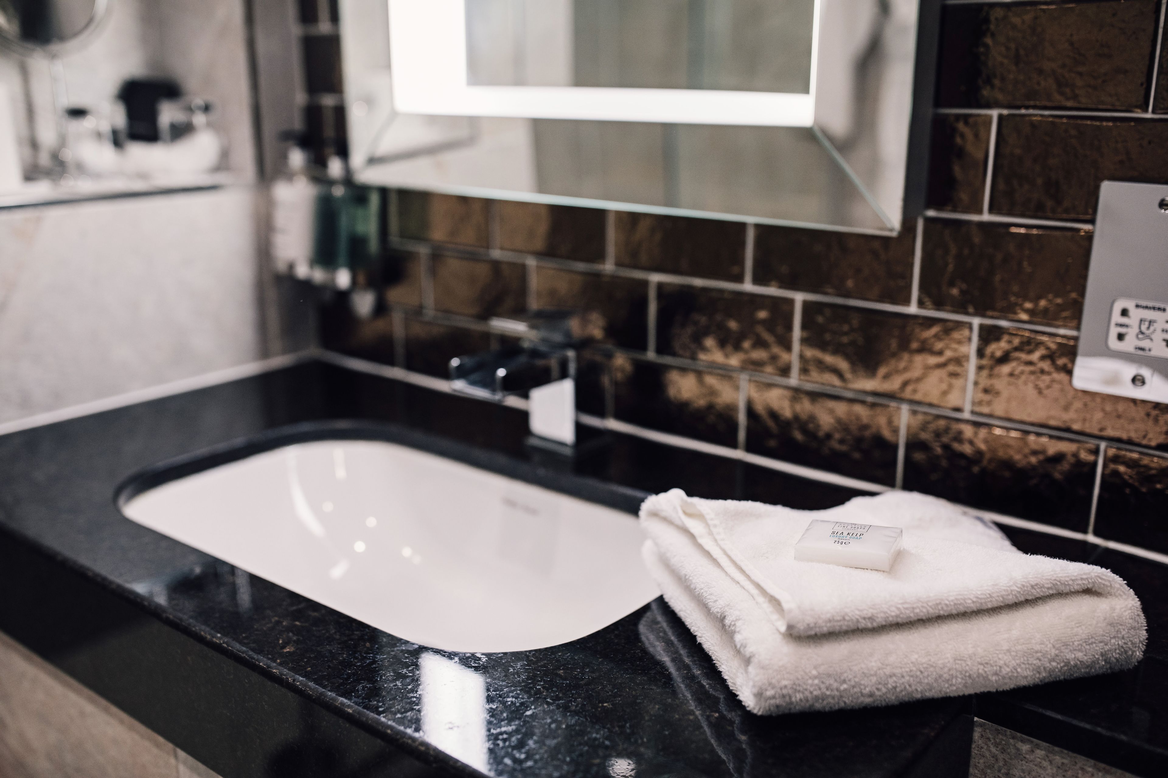 combined shower/bathtub, hair dryer, towels, soap