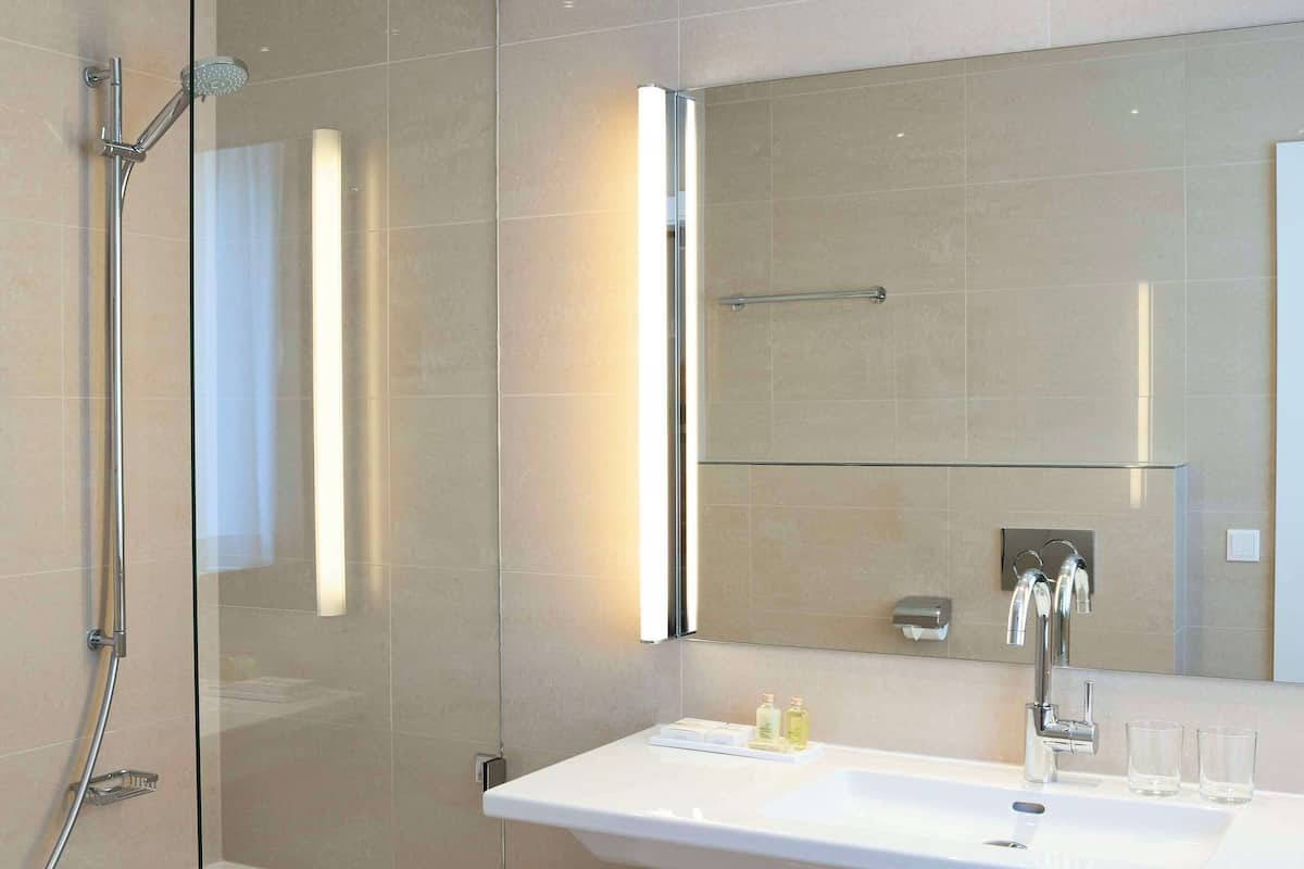 designer toiletries, hair dryer, bathrobes, slippers