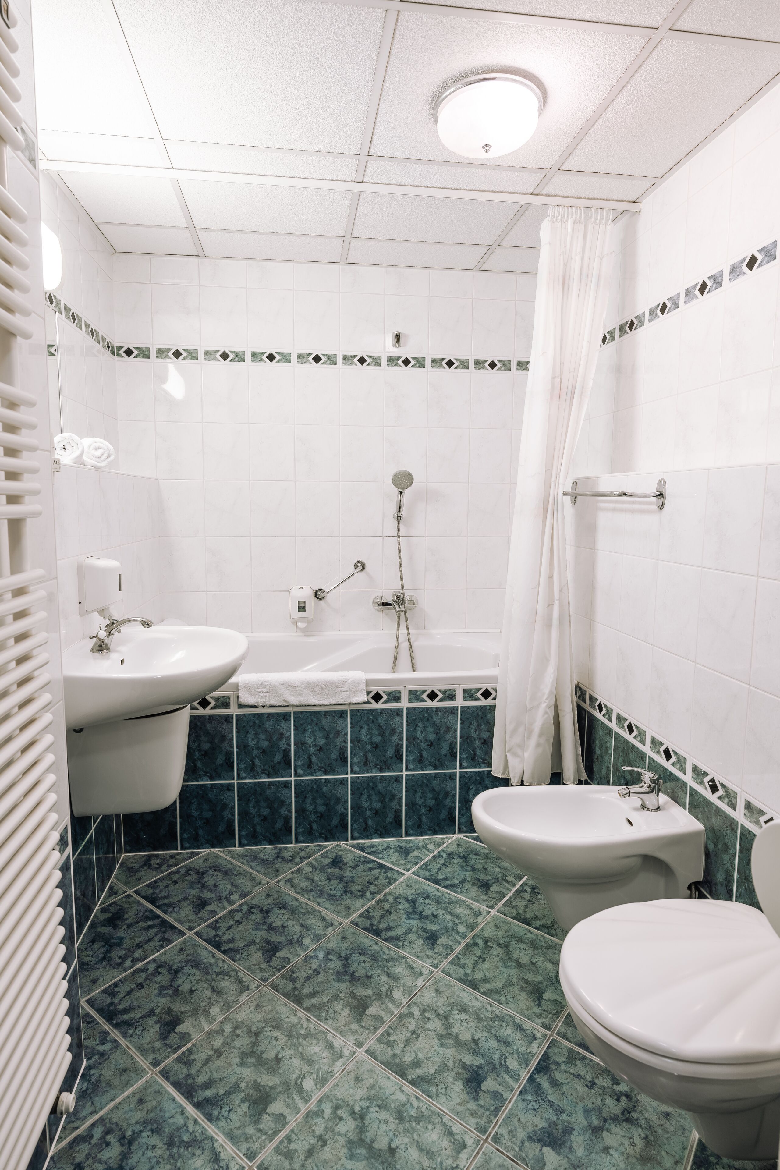 panoramic room, lanai, city view | bathroom | shower, hair dryer, towels