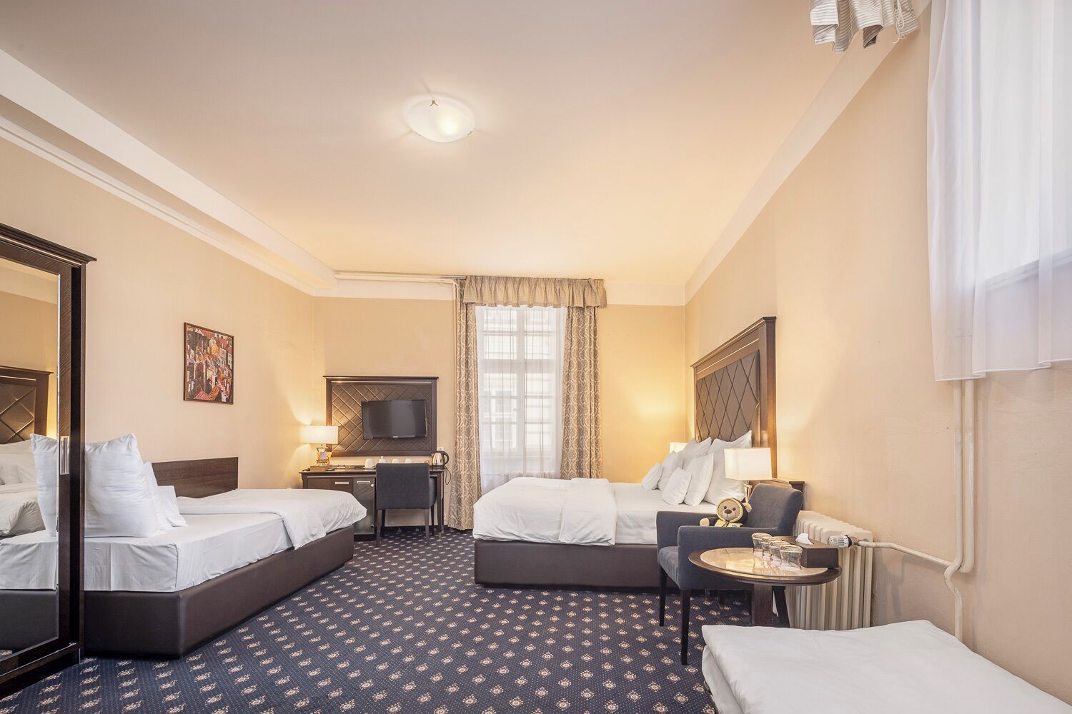 deluxe quadruple room | hypo-allergenic bedding, minibar, in-room safe, desk