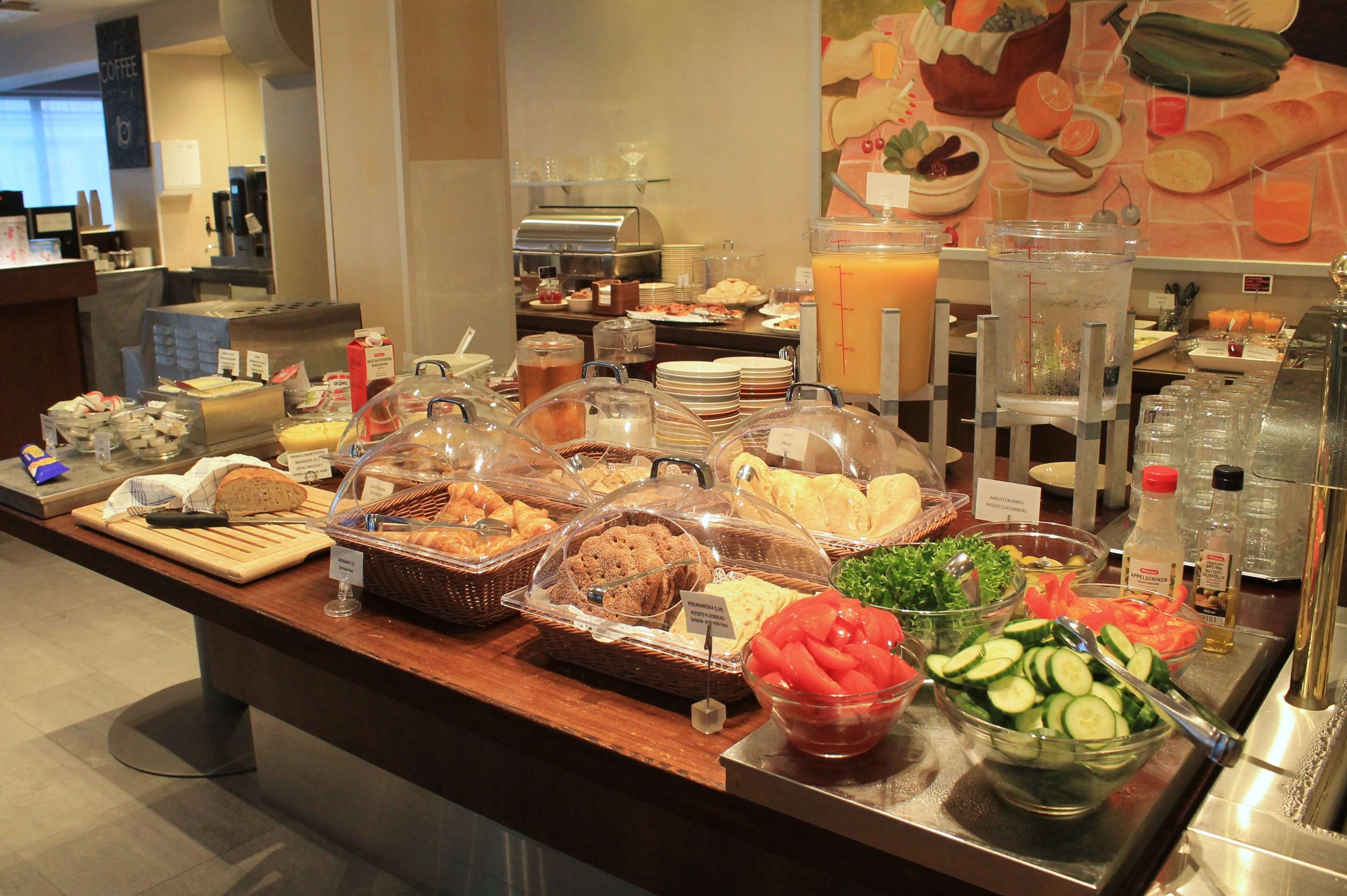 A buffet with various food items and beverages.