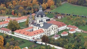 An aerial view of a large, historic building complex with multiple white buildings and a central structure featuring a prominent dome. - Best Western Santakos Hotel (Kaunas)