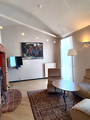 Suite, Multiple Beds, Smoking (Living Room) | Living area | TV, heated floors