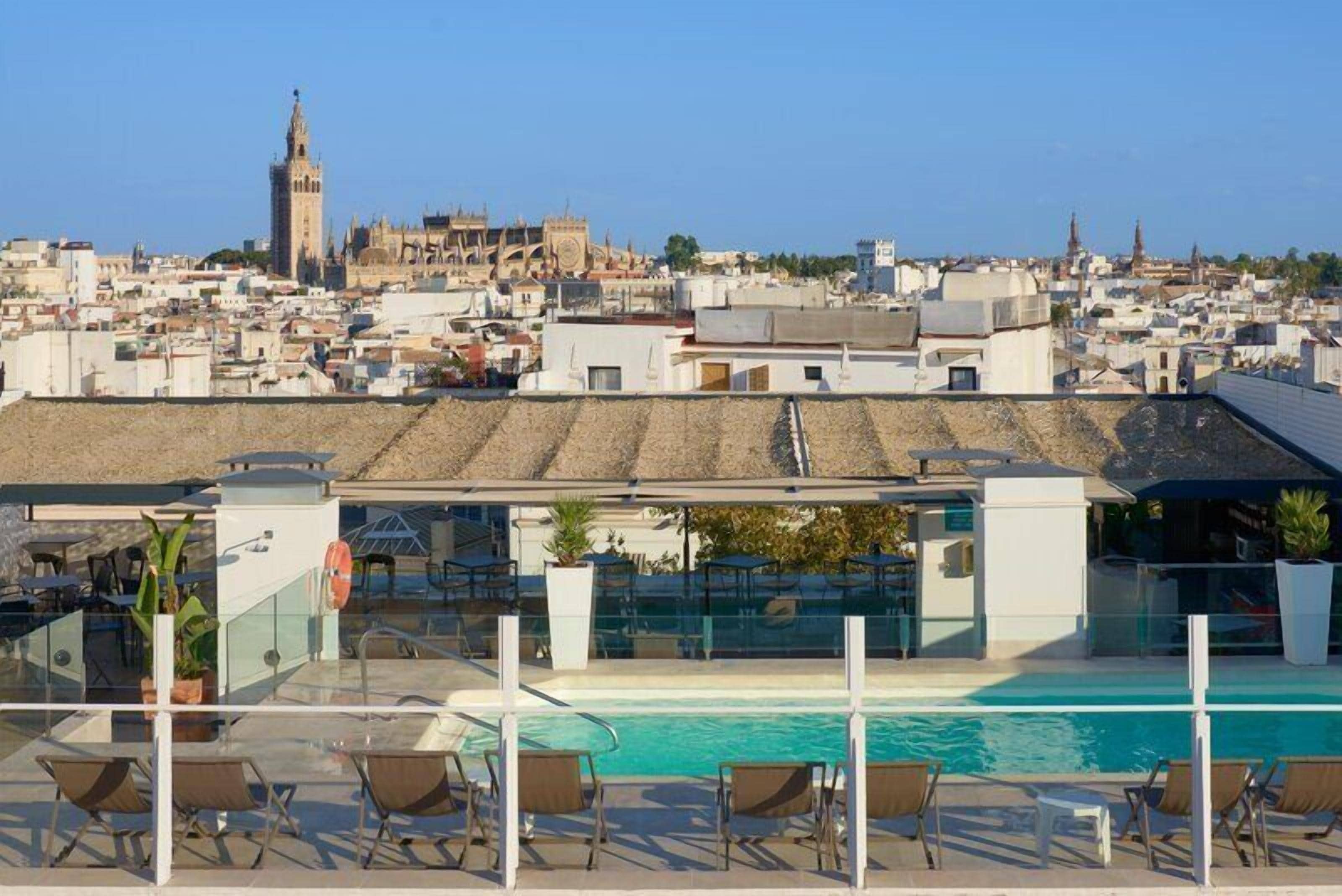 Seasonal outdoor pool, pool umbrellas, pool loungers