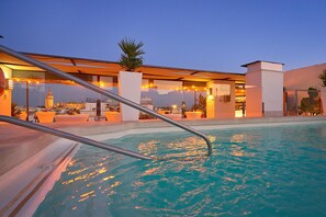 Seasonal outdoor pool, pool umbrellas, sun loungers