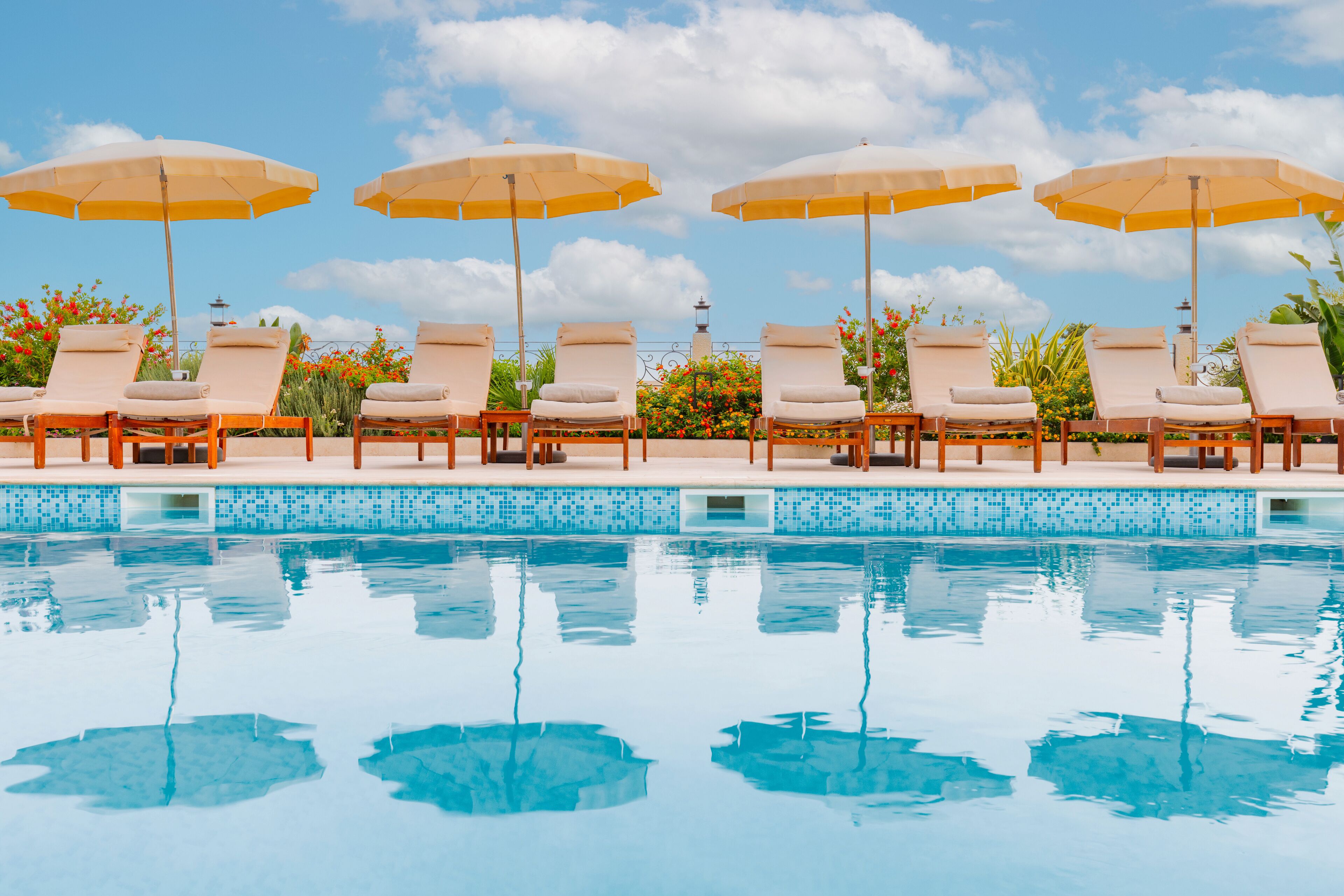 seasonal outdoor pool, pool umbrellas, pool loungers